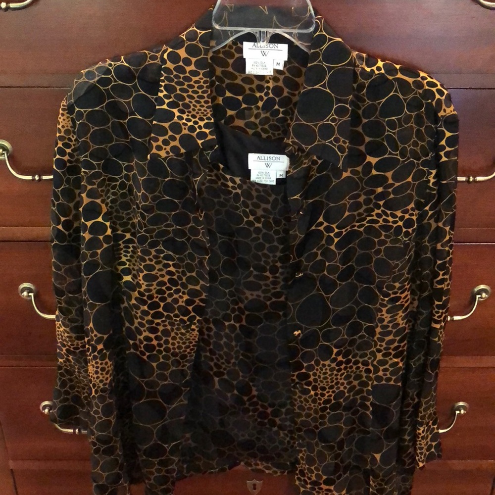 Sheer blouse with matching sleeveless top.